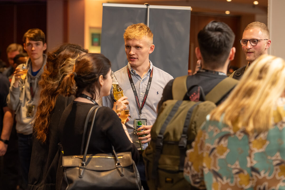 Attendees talking at CyberThreat 2023